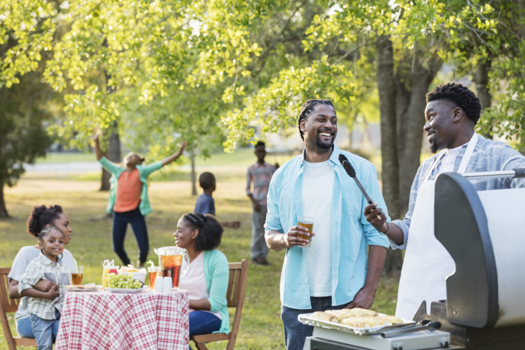 Large family BBQing at a picnic